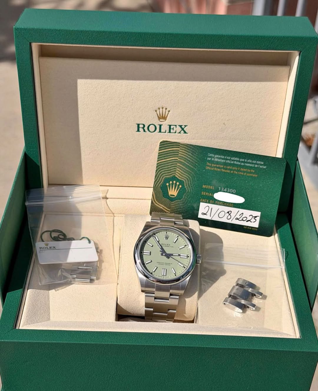 May be an image of wrist watch and text