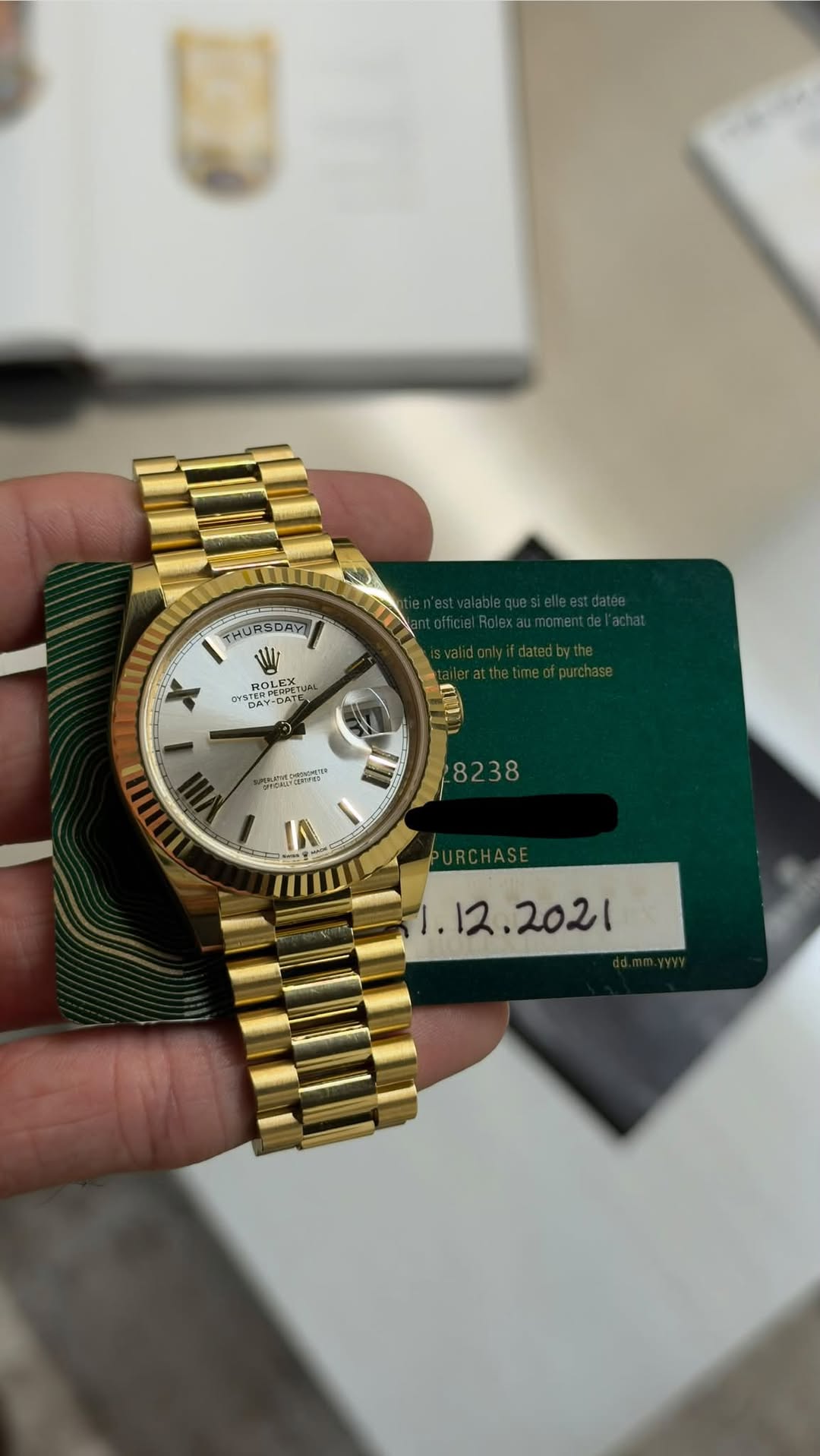 May be an image of wrist watch and text