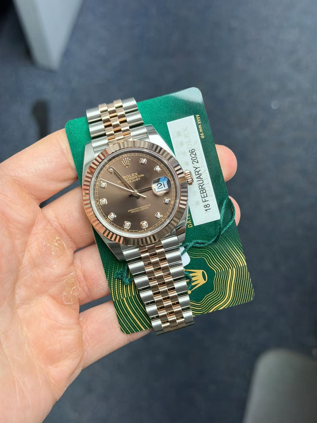 May be an image of wrist watch and text