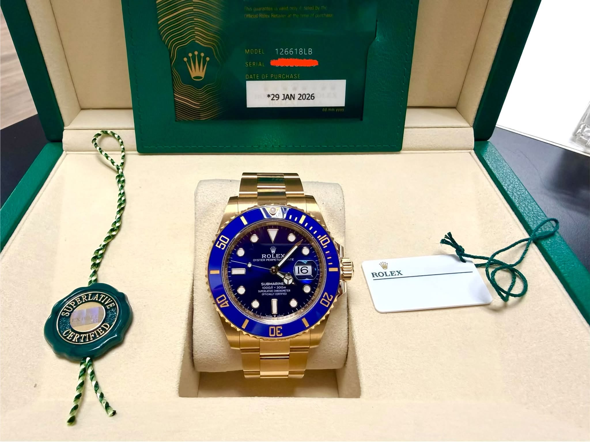 May be an image of wrist watch and text that says '1266 126618LB BLB *29 JAN 2026 50 ROLE EX ROL OLE HOPET 10 16 naH4иHH e; Shir ROLEX SUPERLATIE SUP ATIVE CERTIFIED CER ERTIFIE 40…