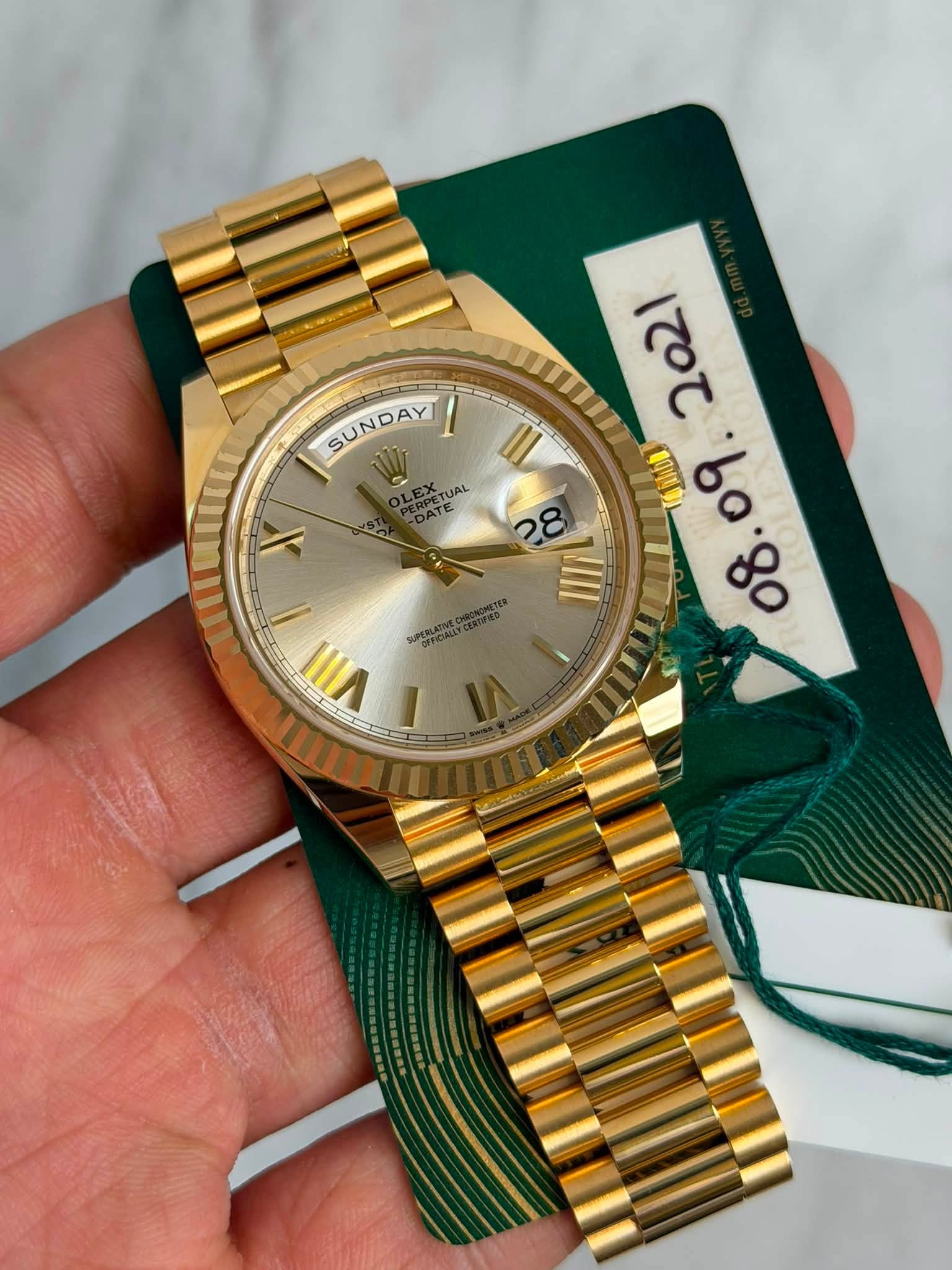 May be an image of wrist watch and text