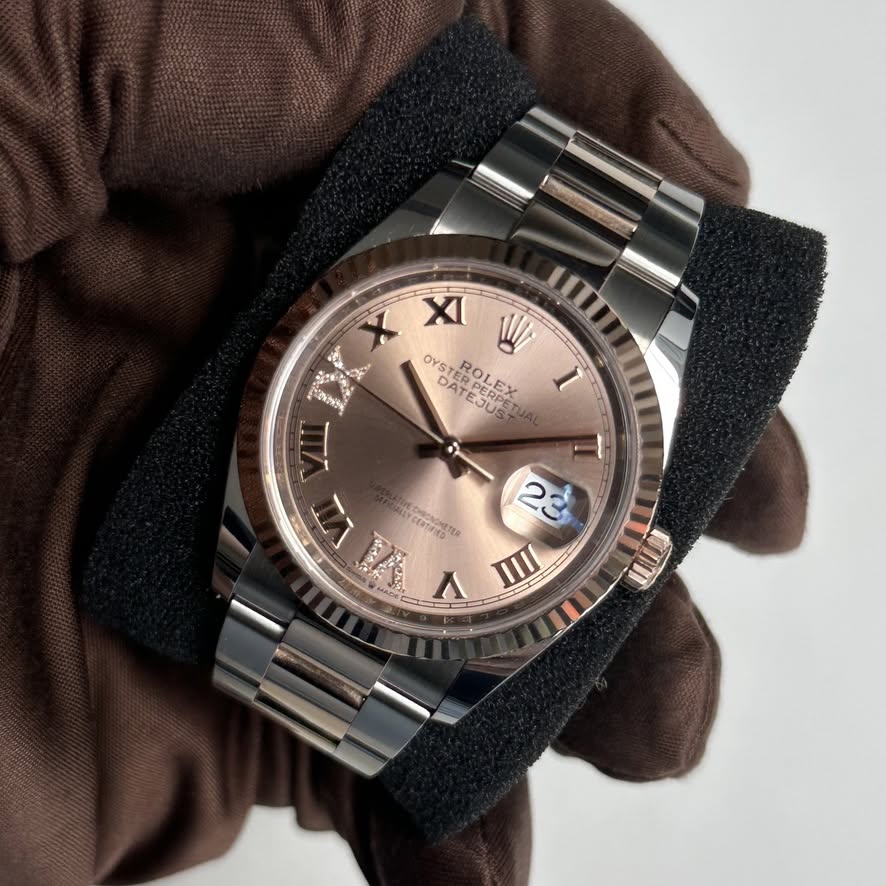 May be an image of wrist watch and text