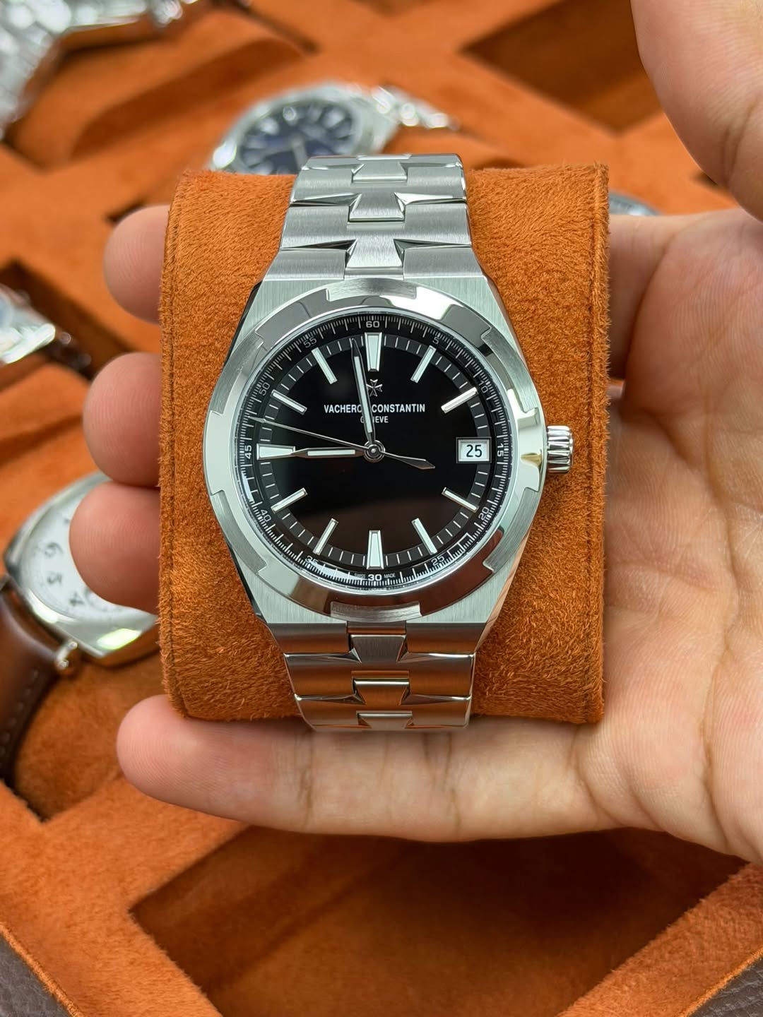 May be an image of wrist watch, leather and text