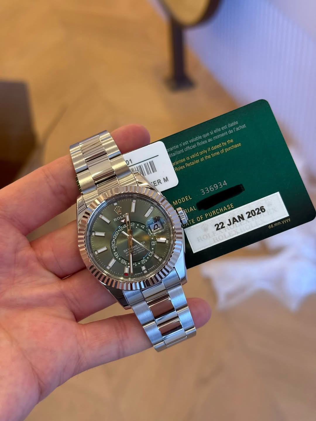 May be an image of wrist watch and text that says 'elleest acл3T nomento Retalerattheti netm 8 orpauиcлaBe validonly ER M R 4 336934 MODEL SRIAL AL OF PURCHASE 2026 22 JAN ROLI…
