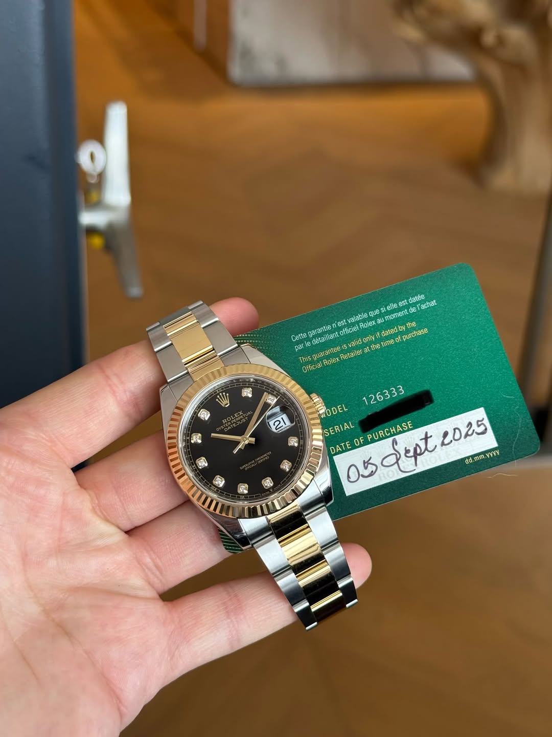 May be an image of wrist watch and text