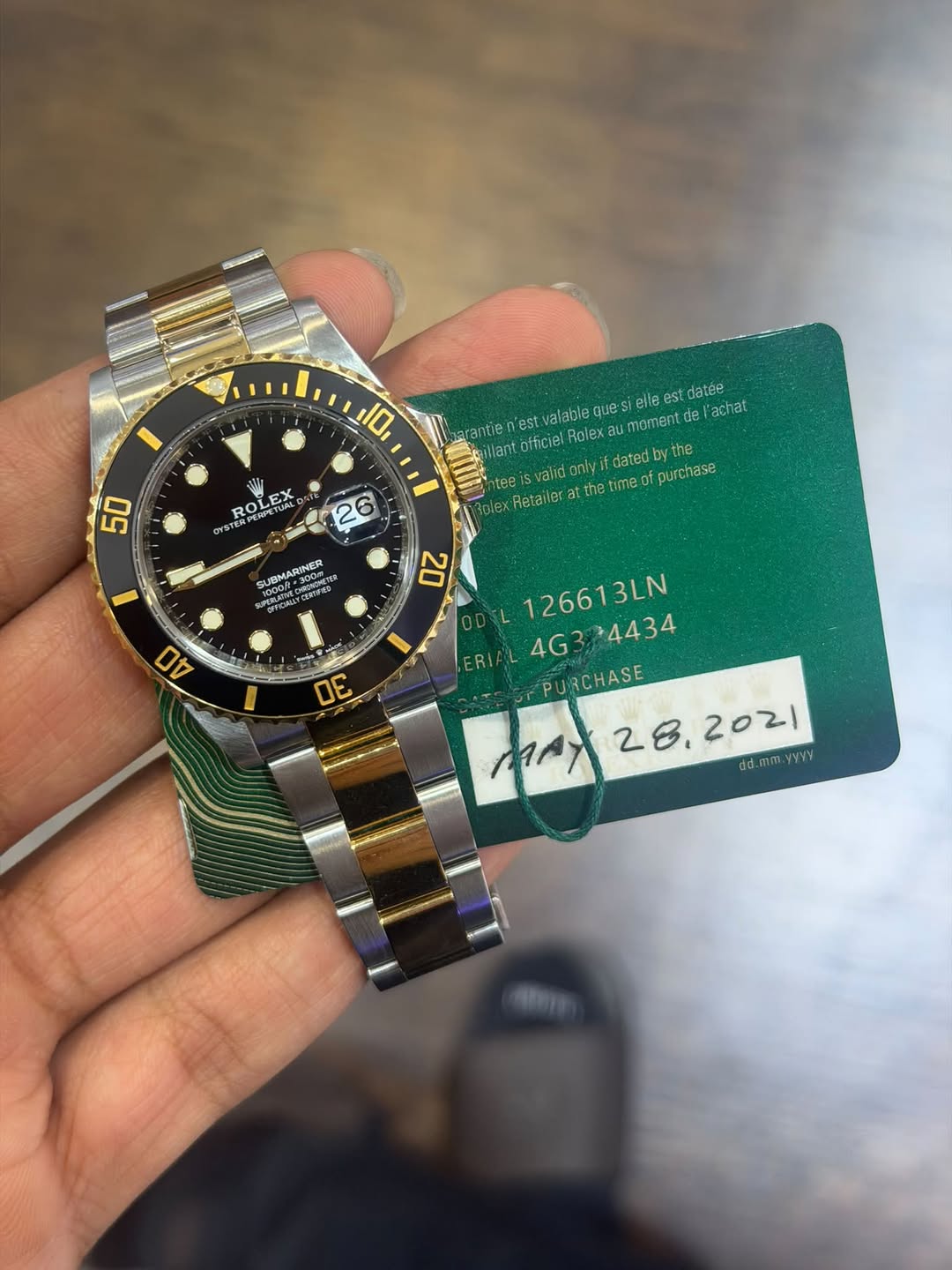 May be an image of wrist watch and text