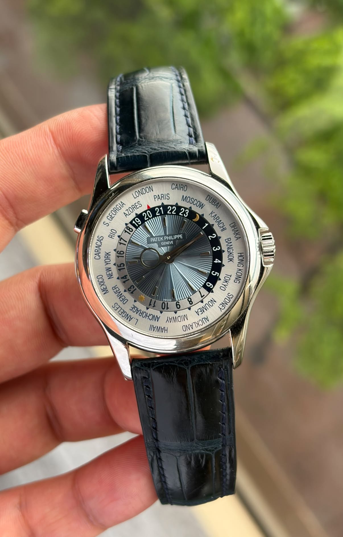 May be an image of wrist watch and text