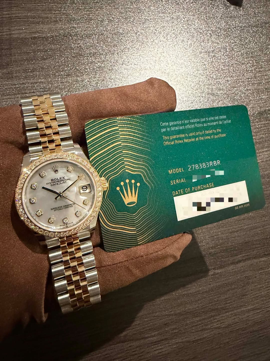 May be an image of wrist watch, money and text