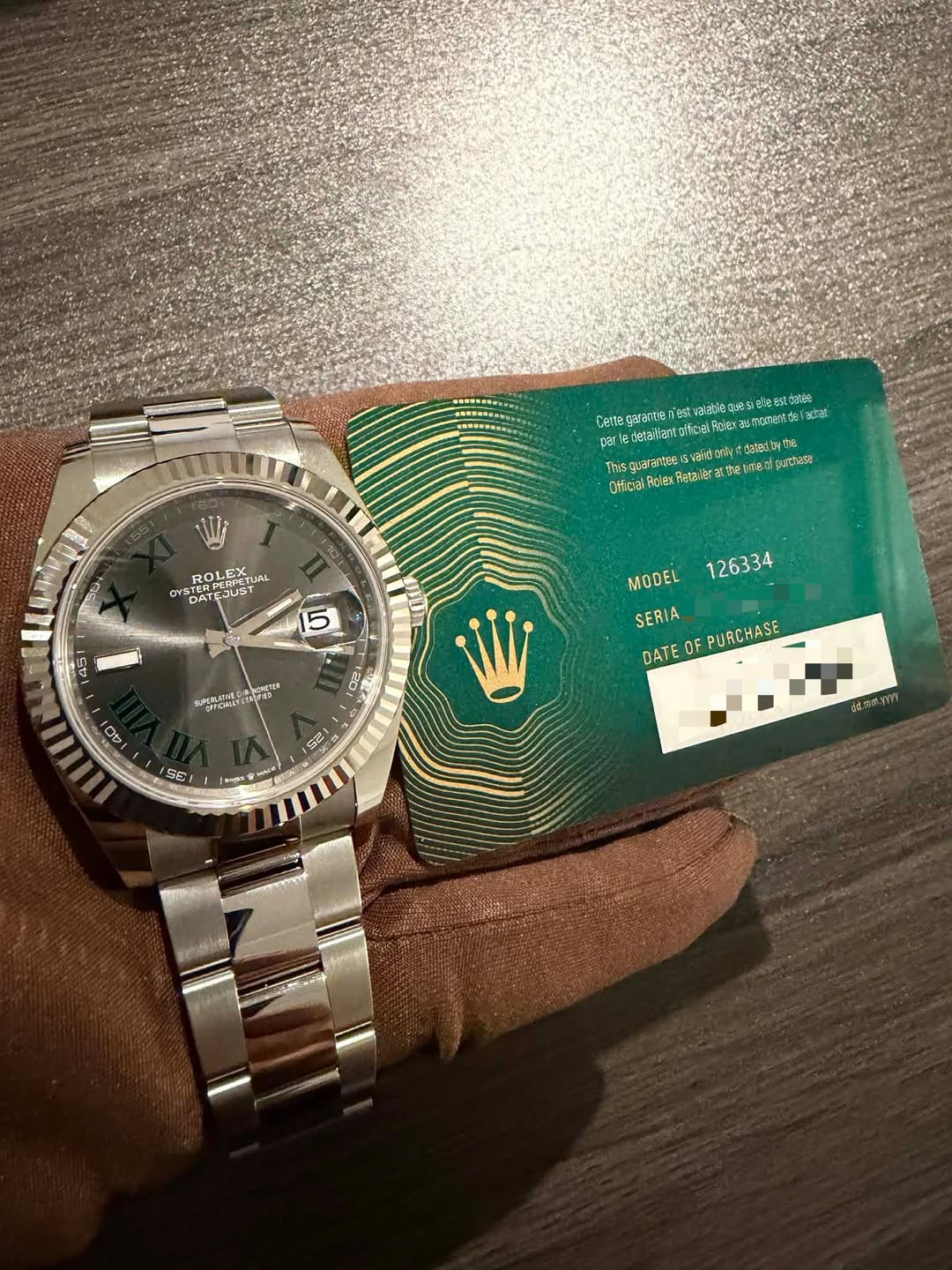 May be an image of wrist watch and text
