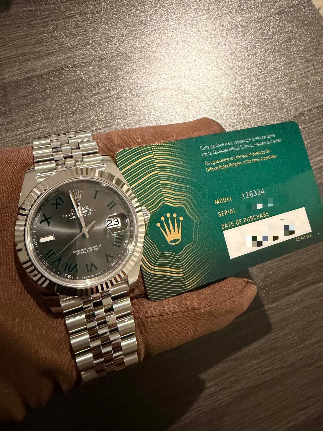 May be an image of wrist watch and text