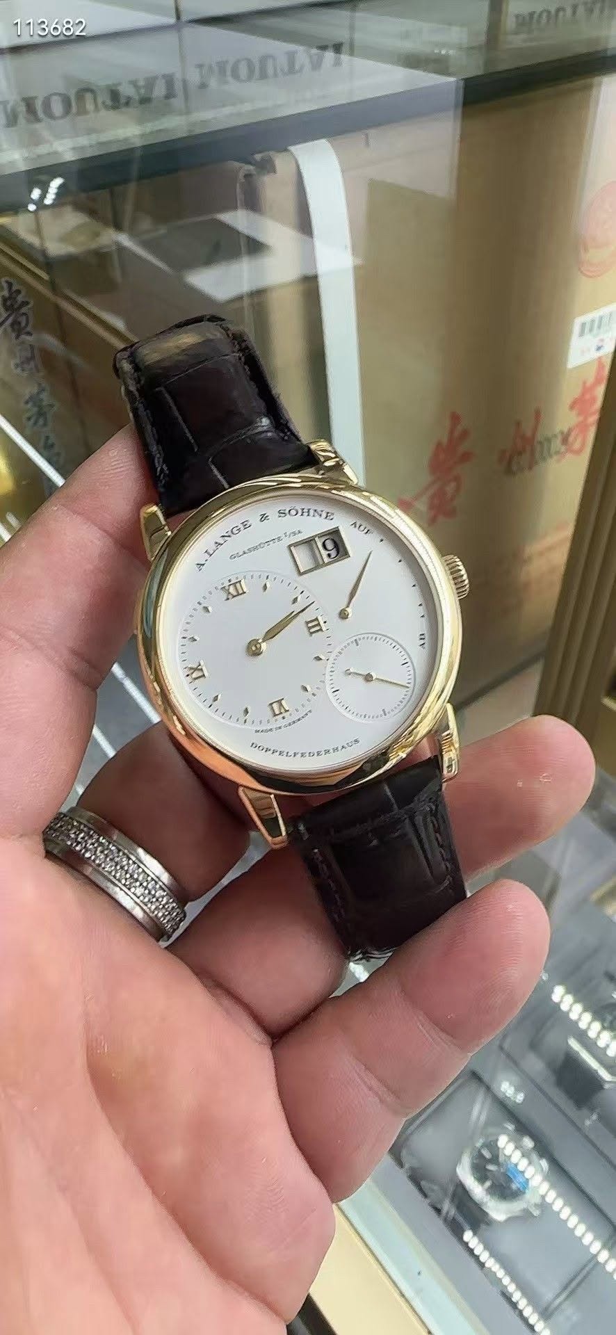 May be an image of wrist watch and text