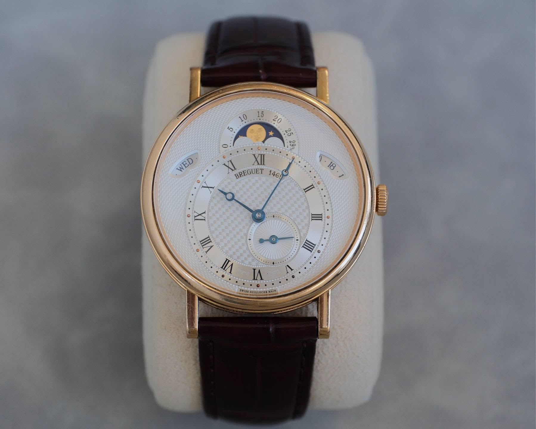 May be an image of wrist watch and text