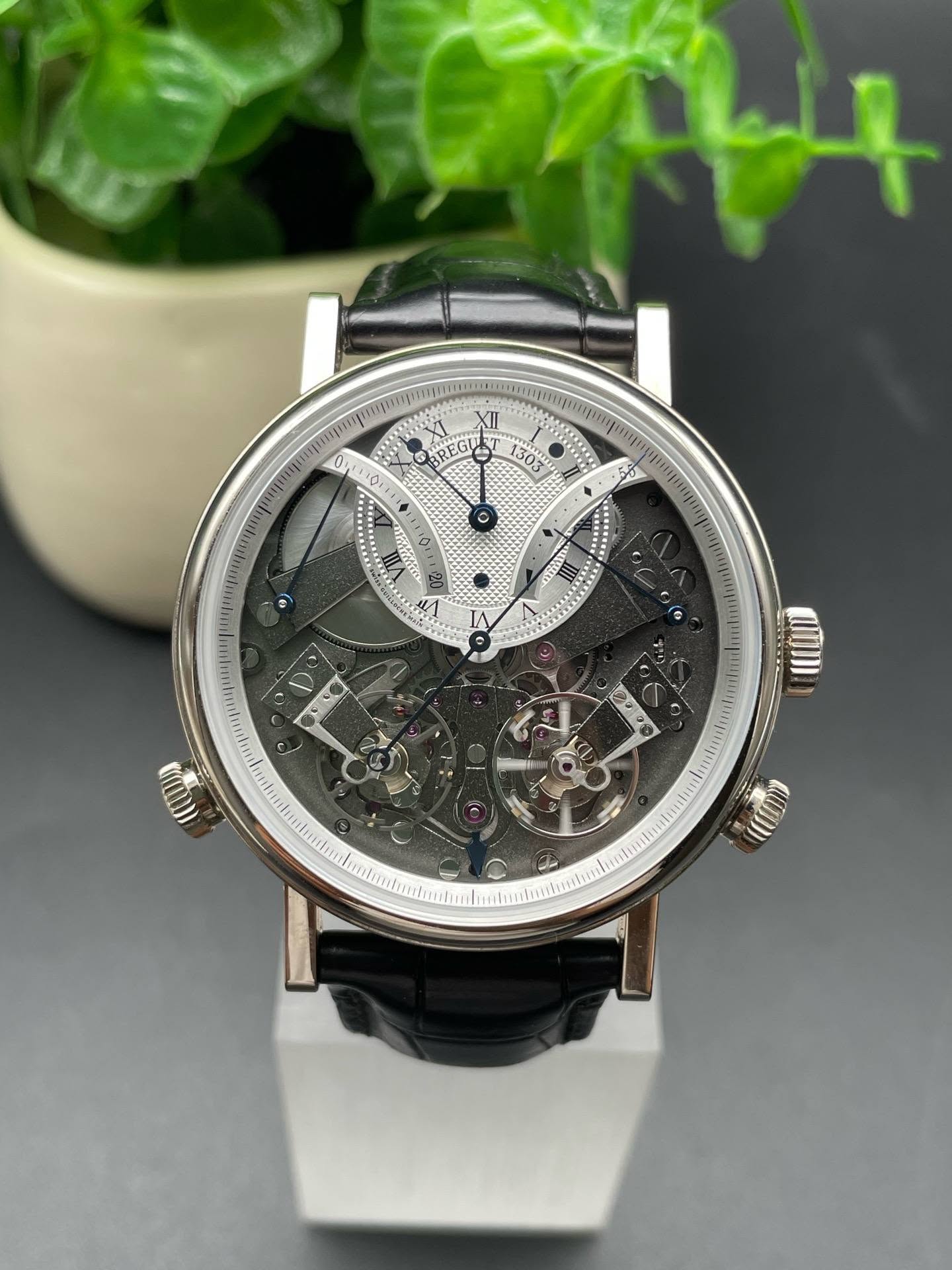 May be an image of wrist watch and text