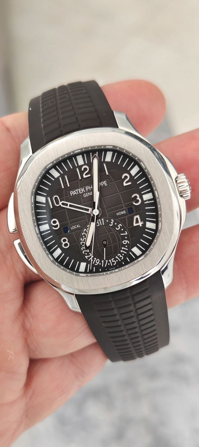 May be an image of wrist watch and text that says '12 11 OPE PATEK PH Q GENG 6 LOCAL 2 3 HOME 311 ? • ی 4 7 ر۰ % '