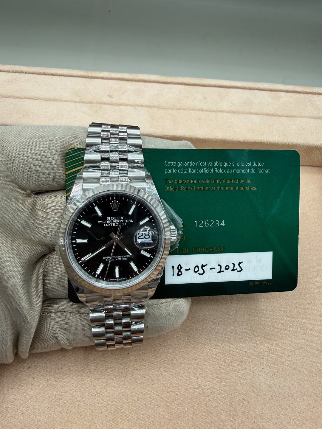 May be an image of wrist watch and text