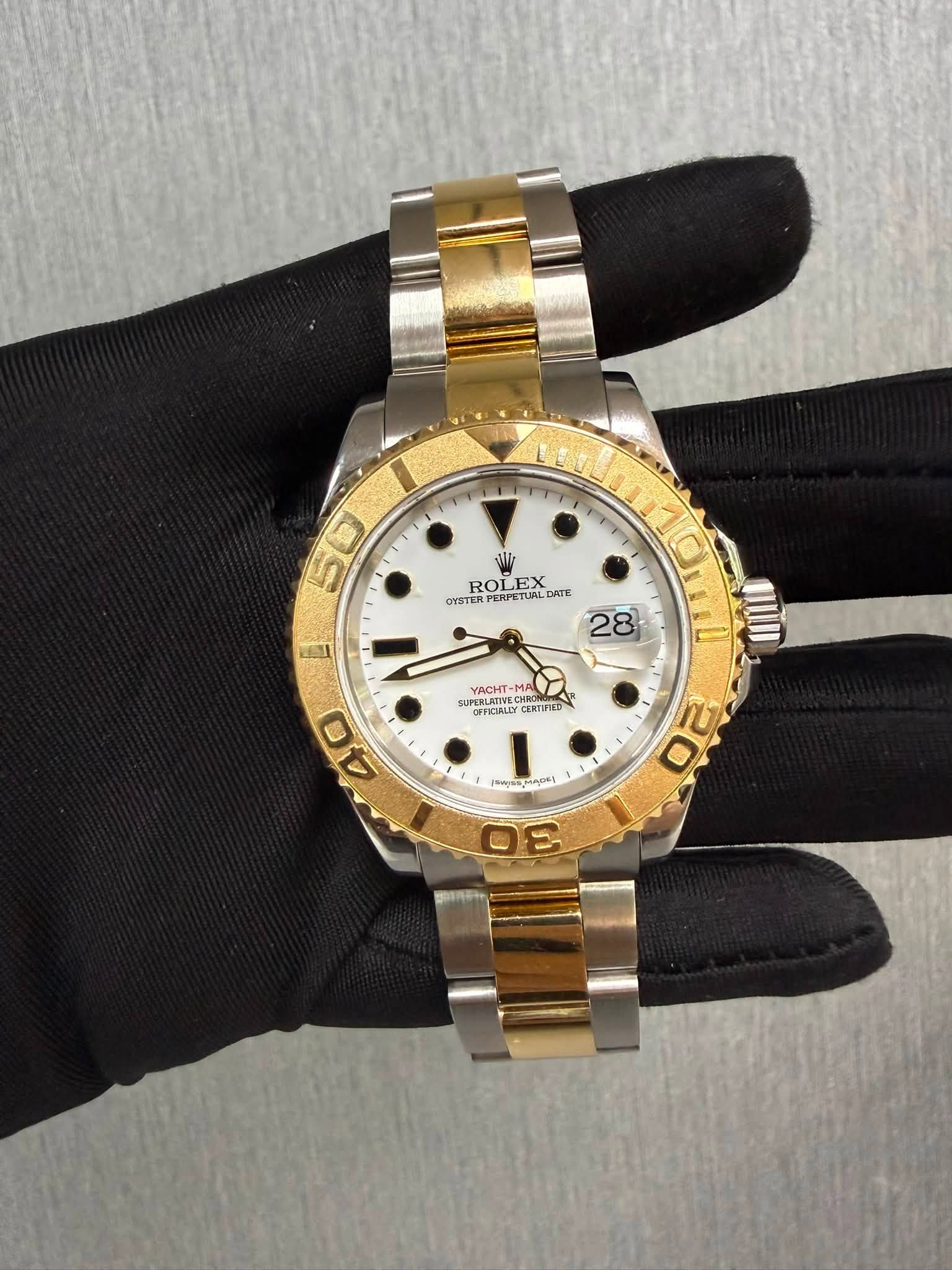 May be an image of wrist watch and text