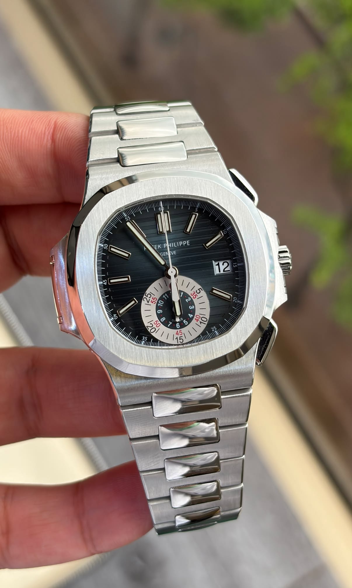 May be an image of wrist watch and text