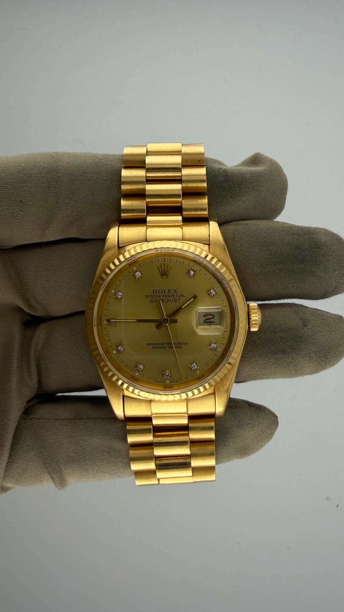 May be an image of wrist watch and text
