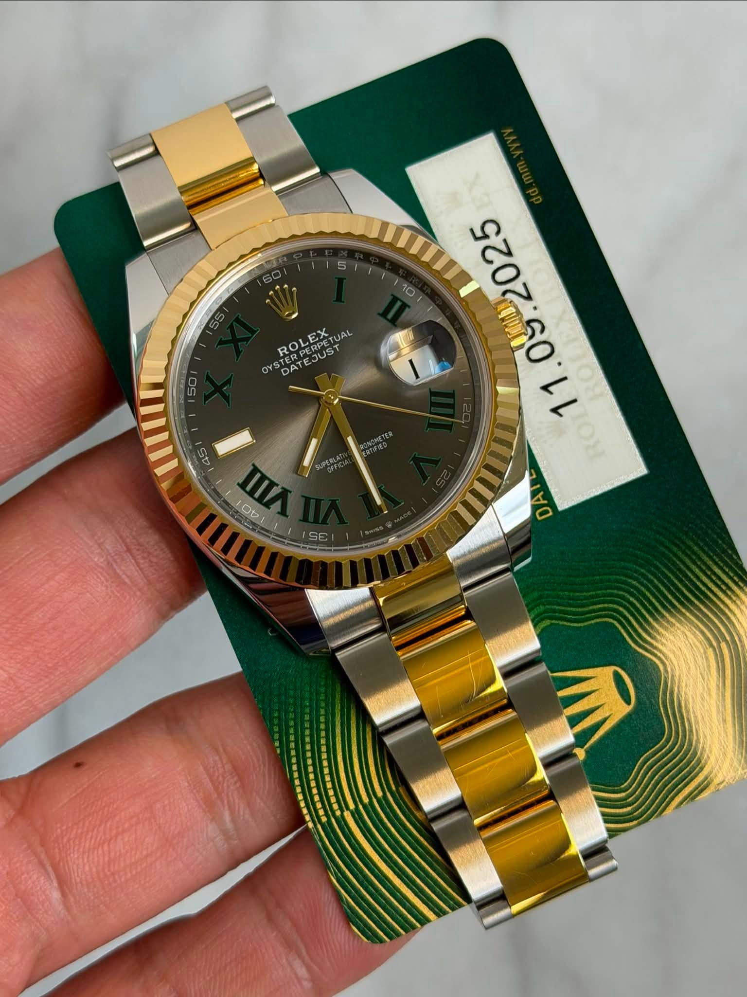 May be an image of wrist watch and text that says '5 ROLEX ROLEX EJUST JOST JAL OYS DATEERPE DAT WAT OH DAT 0 1 45 IW 100 sE'