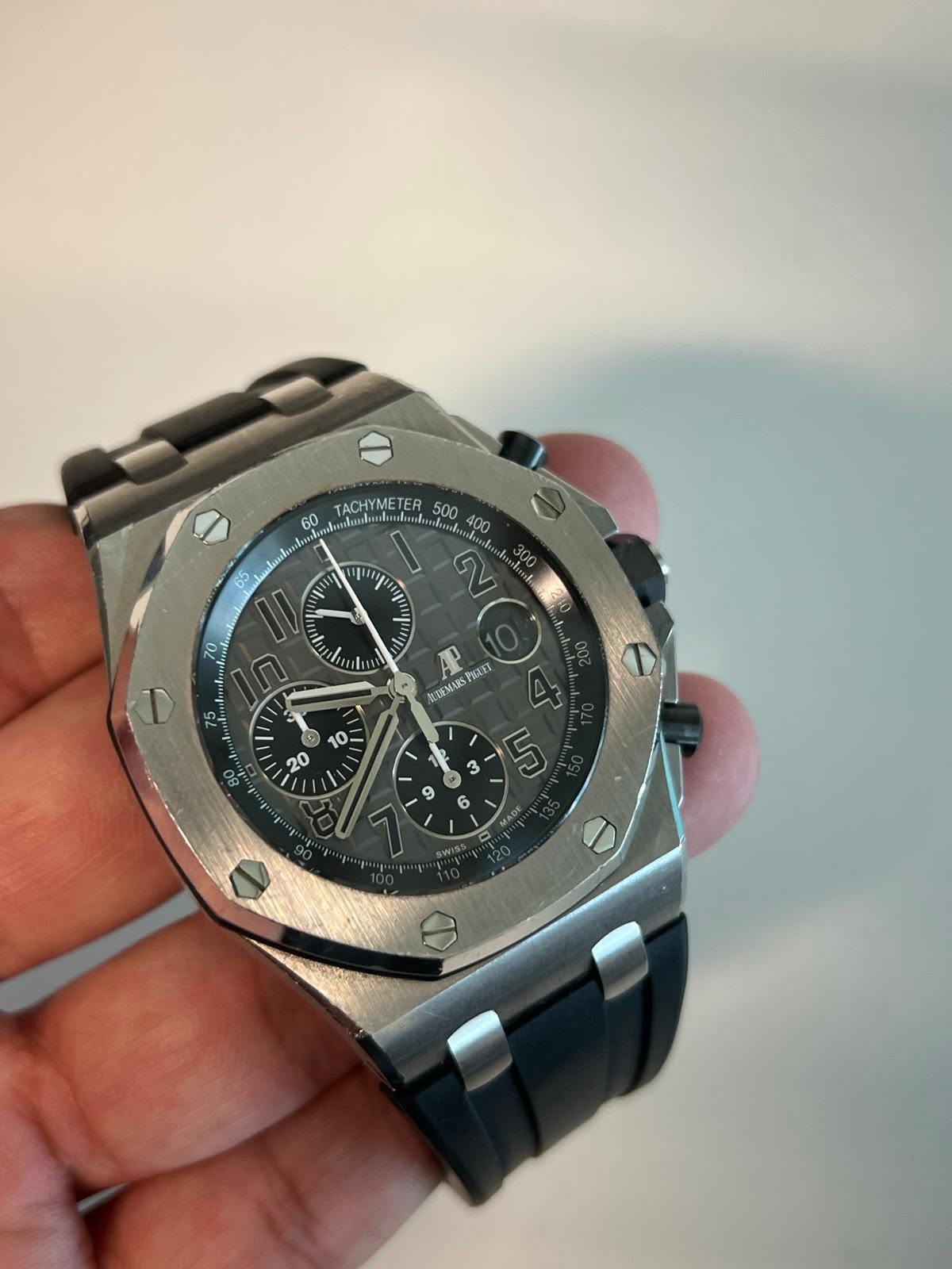 May be an image of wrist watch and text