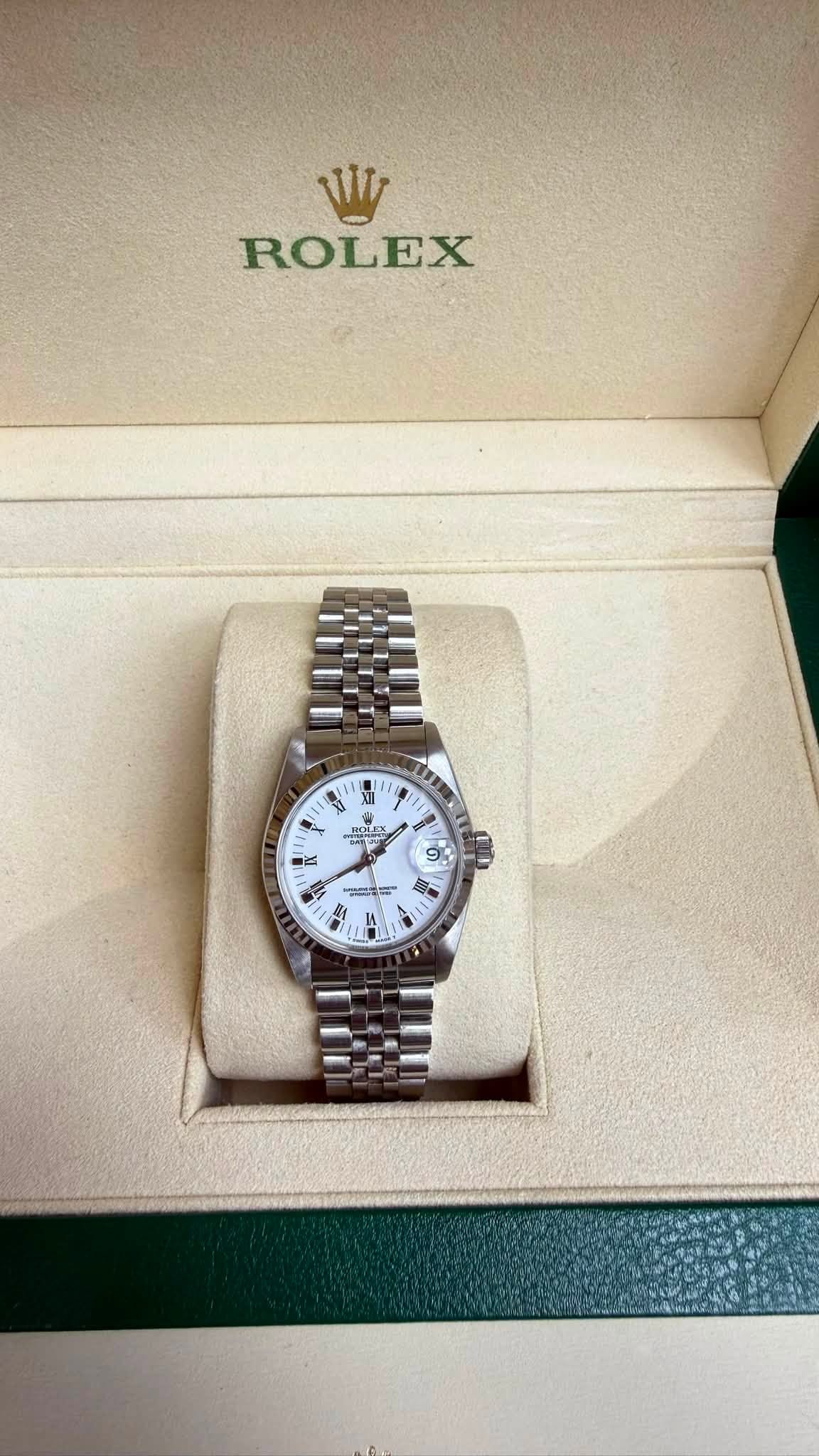May be an image of wrist watch and text that says 'Wy ROLEX M N It 8 SUF 1 ያ P 自武 -'