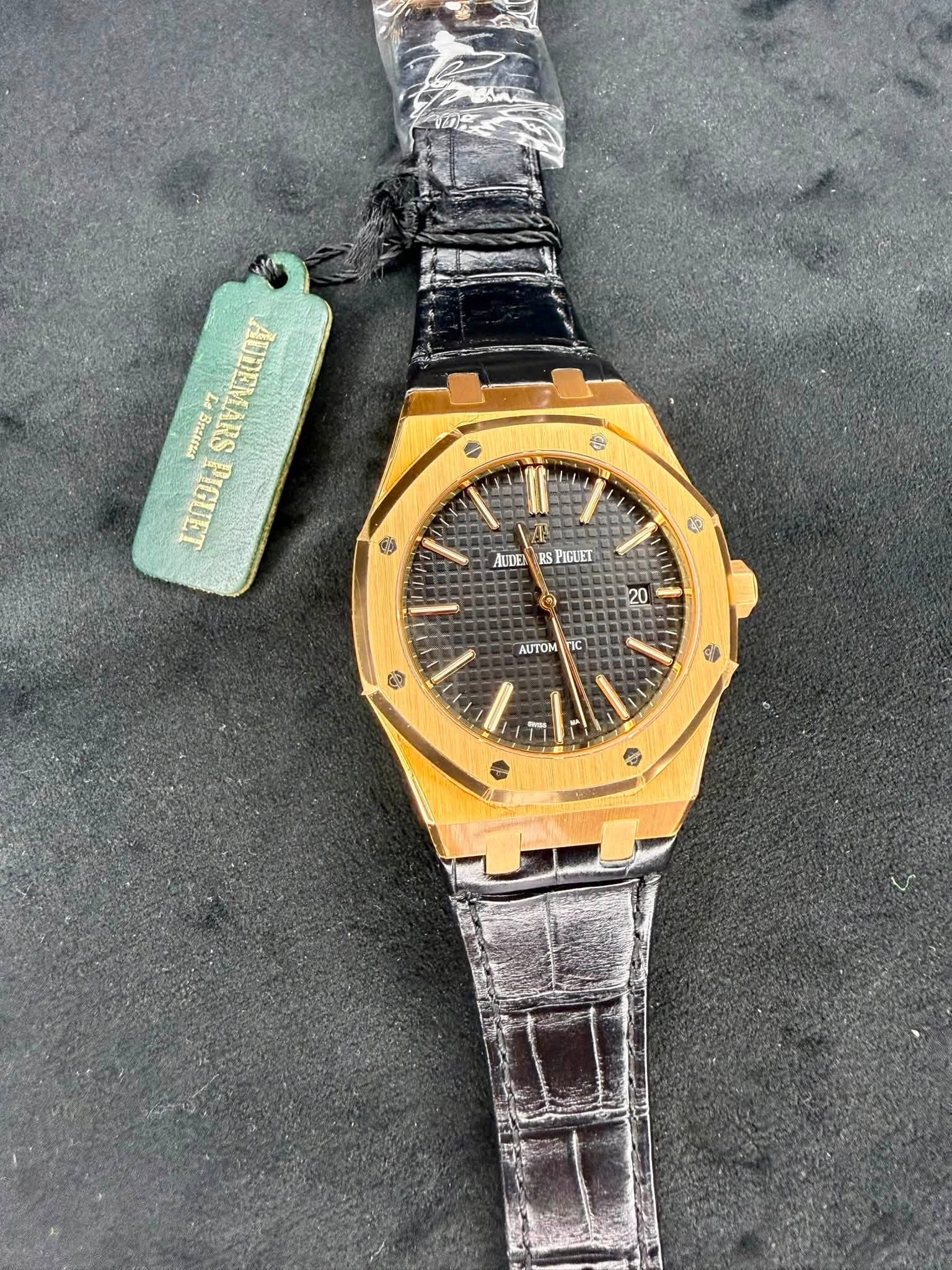 May be an image of wrist watch and text
