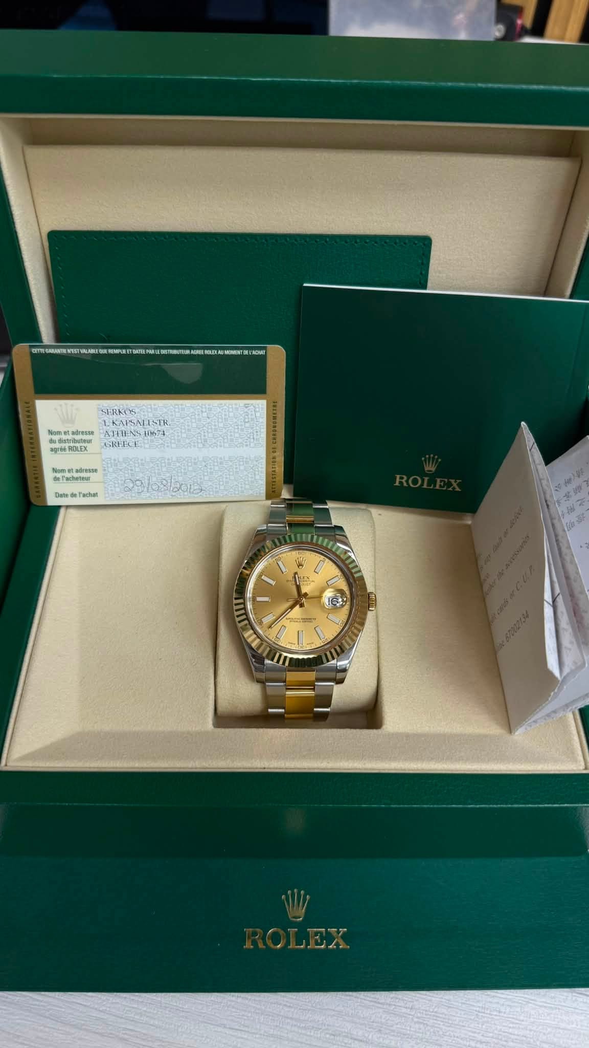 May be an image of wrist watch and text