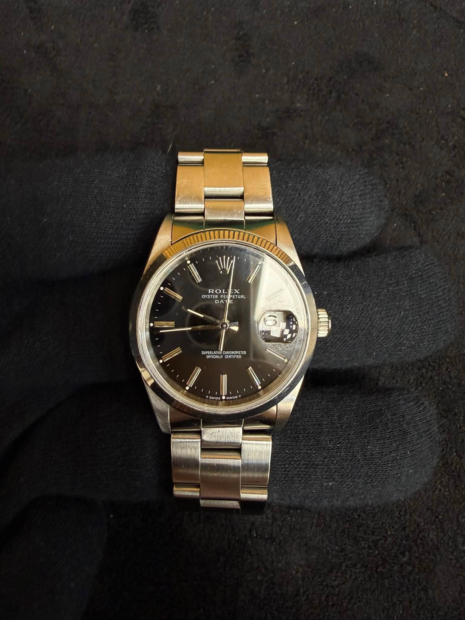 May be an image of wrist watch and text