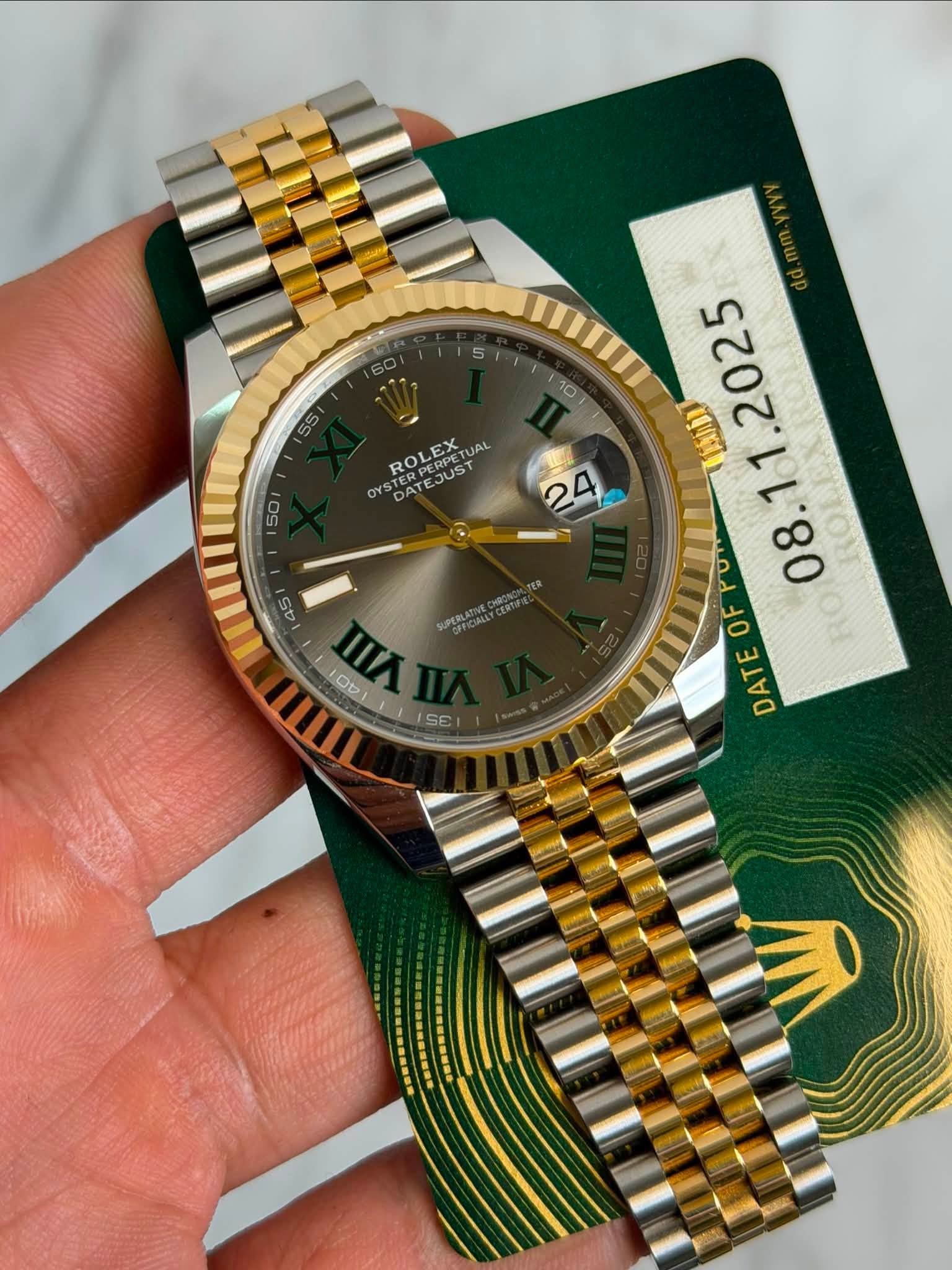 May be an image of wrist watch and text that says '5 55 10 STERPERPE STERPER ROLEX DATEJUST PERPETUA EX UAL ROL JUST 50 2 台力 OFPOR E DATE 0 0 F 45 WA I SE mIn Ob'