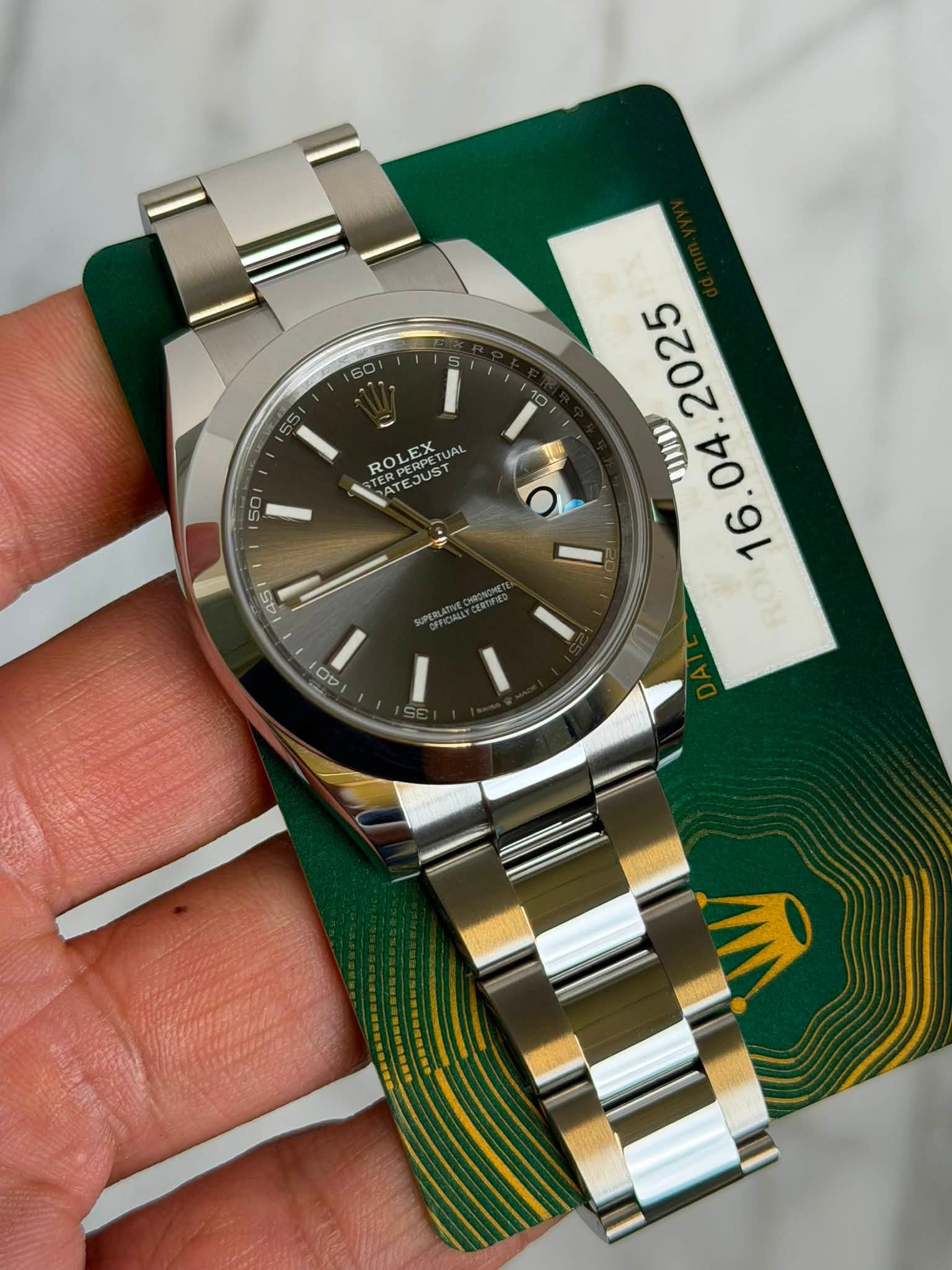 May be an image of wrist watch and text that says '50 2025 ROLEX PE JAL do UaD TERE ROLEXTUAL AT TE JUST ERPERP 16. 45 Ob O'