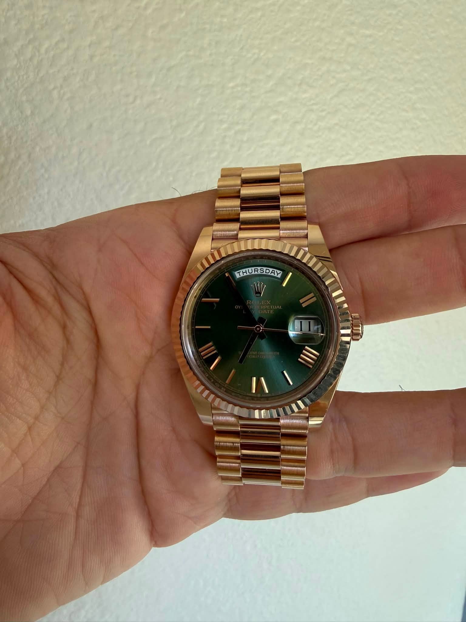 May be an image of wrist watch and text