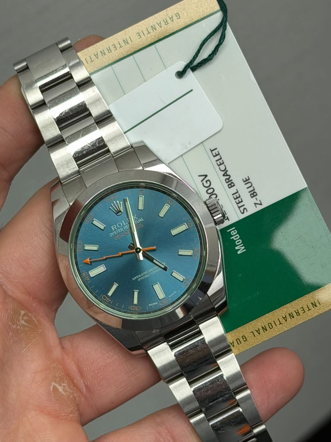 May be an image of wrist watch and text