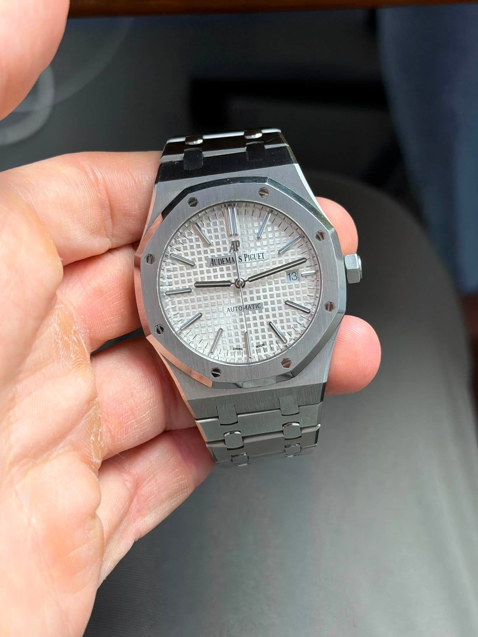 May be an image of wrist watch and text