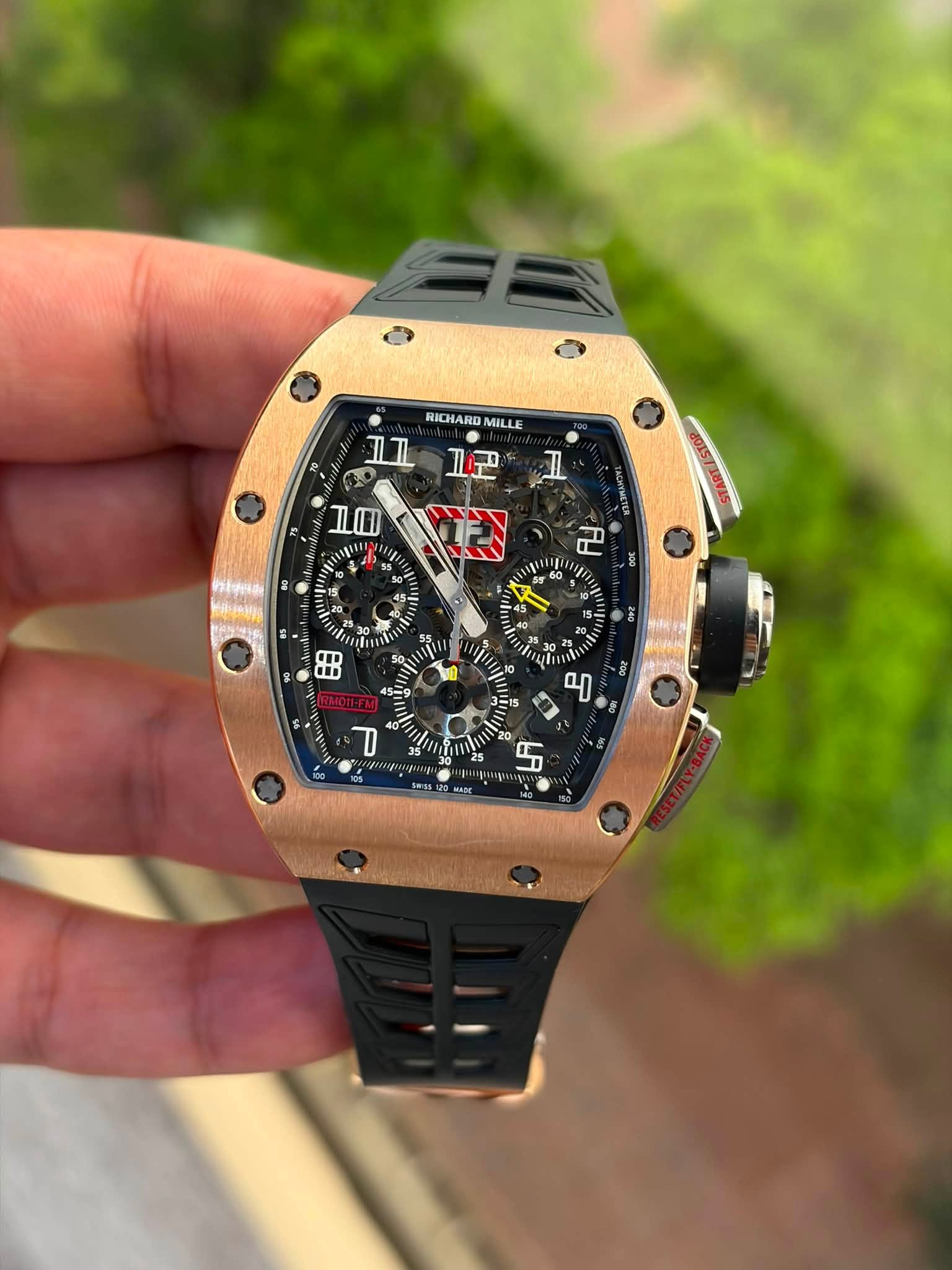 May be an image of wrist watch and text