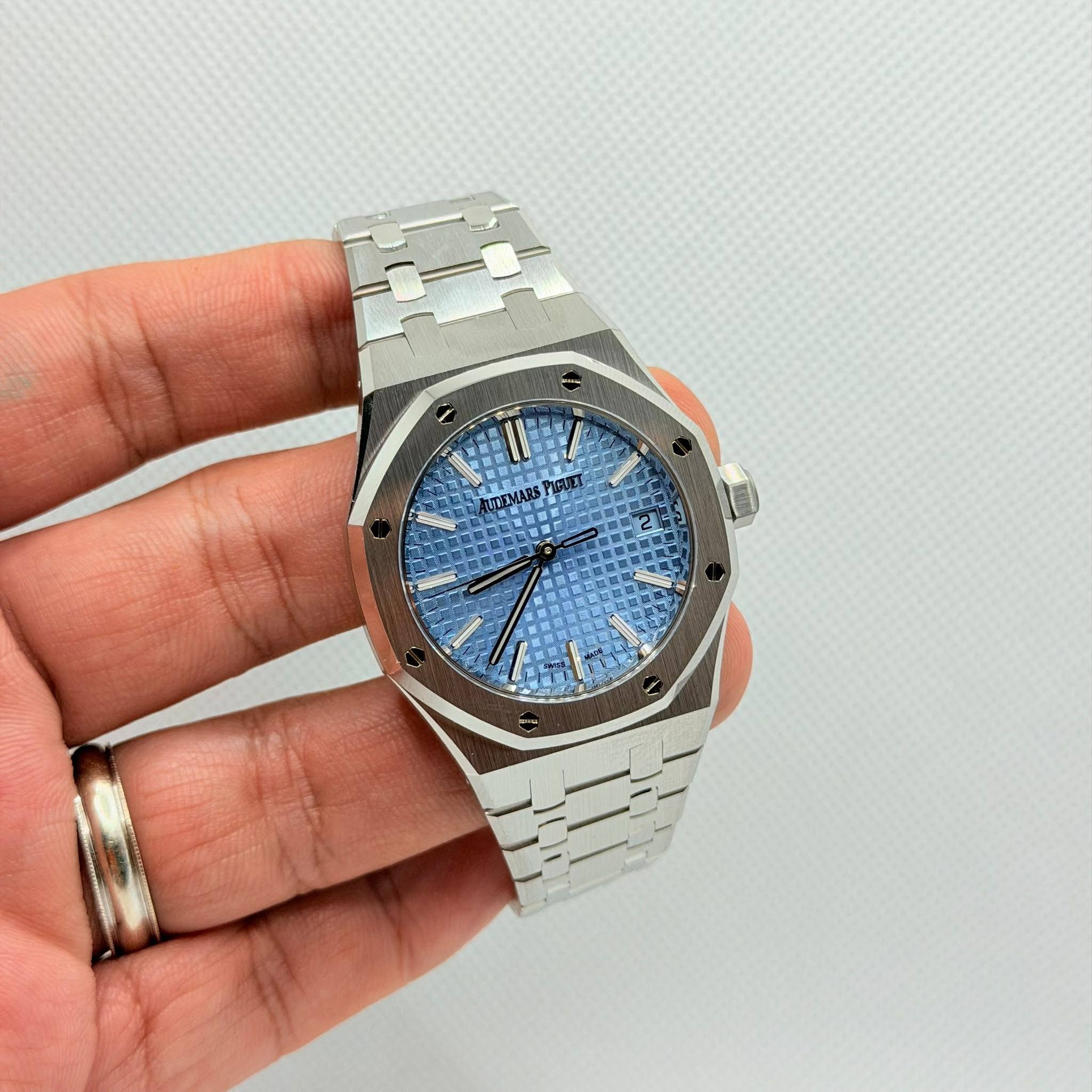 May be an image of wrist watch and text