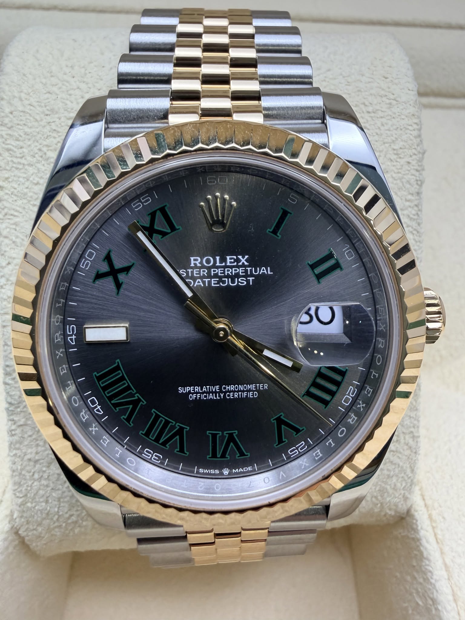 May be an image of wrist watch and text that says '50 ROLEX ŞTER PERPE TERPERPETUAL TUAL DATEJUST R 45 E 0 SUPERLATIVE SUPERLATIVECHRONCMETER CHRONOMETER OFFICIA…