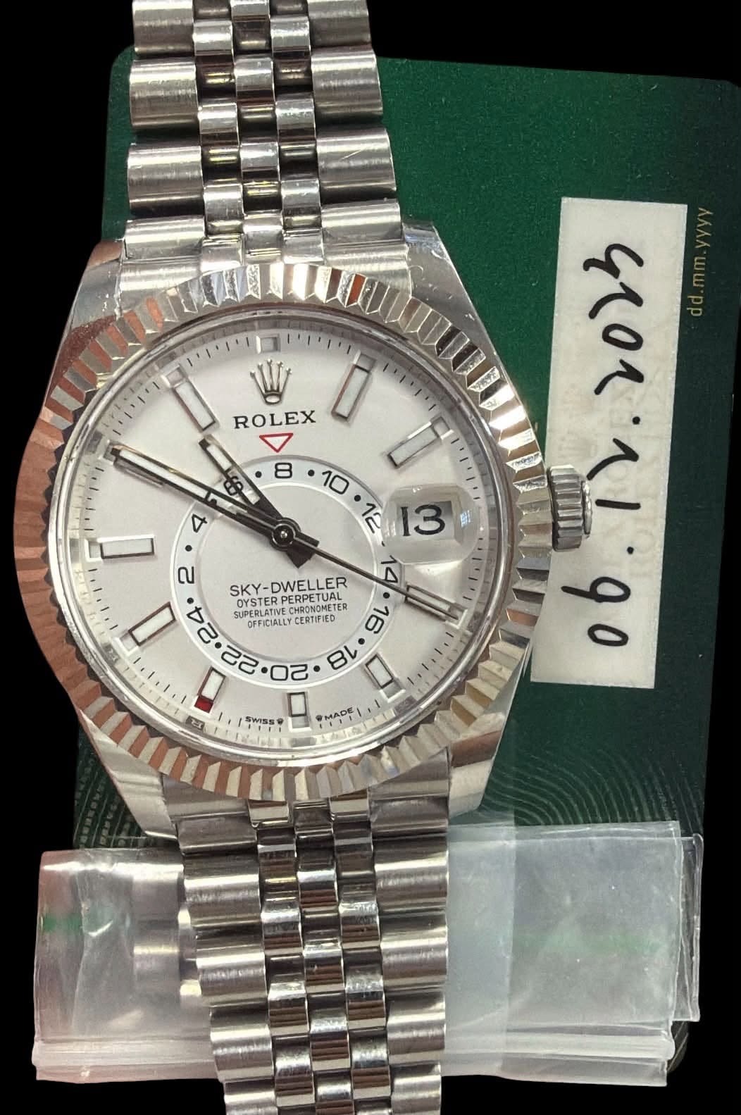 May be an image of wrist watch and text