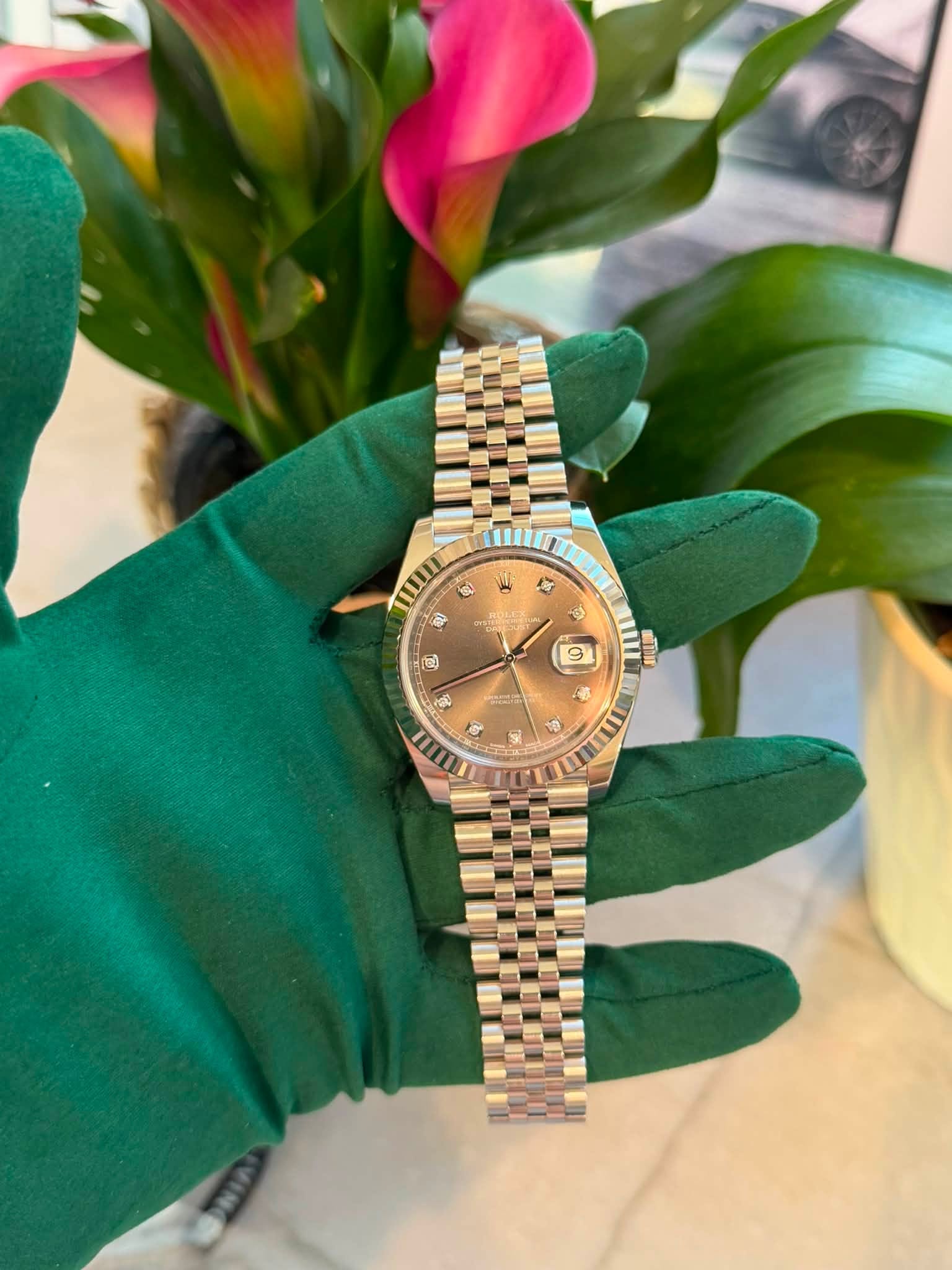 May be an image of wrist watch and text