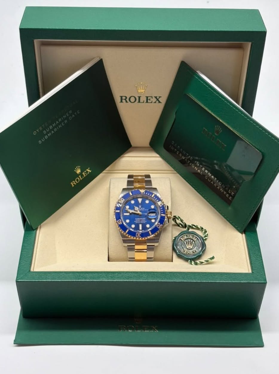 May be an image of wrist watch and text that says 'ROLEX ROLEA ΘX ROL 250 က ulo ት 40 20 SRP OEREL'