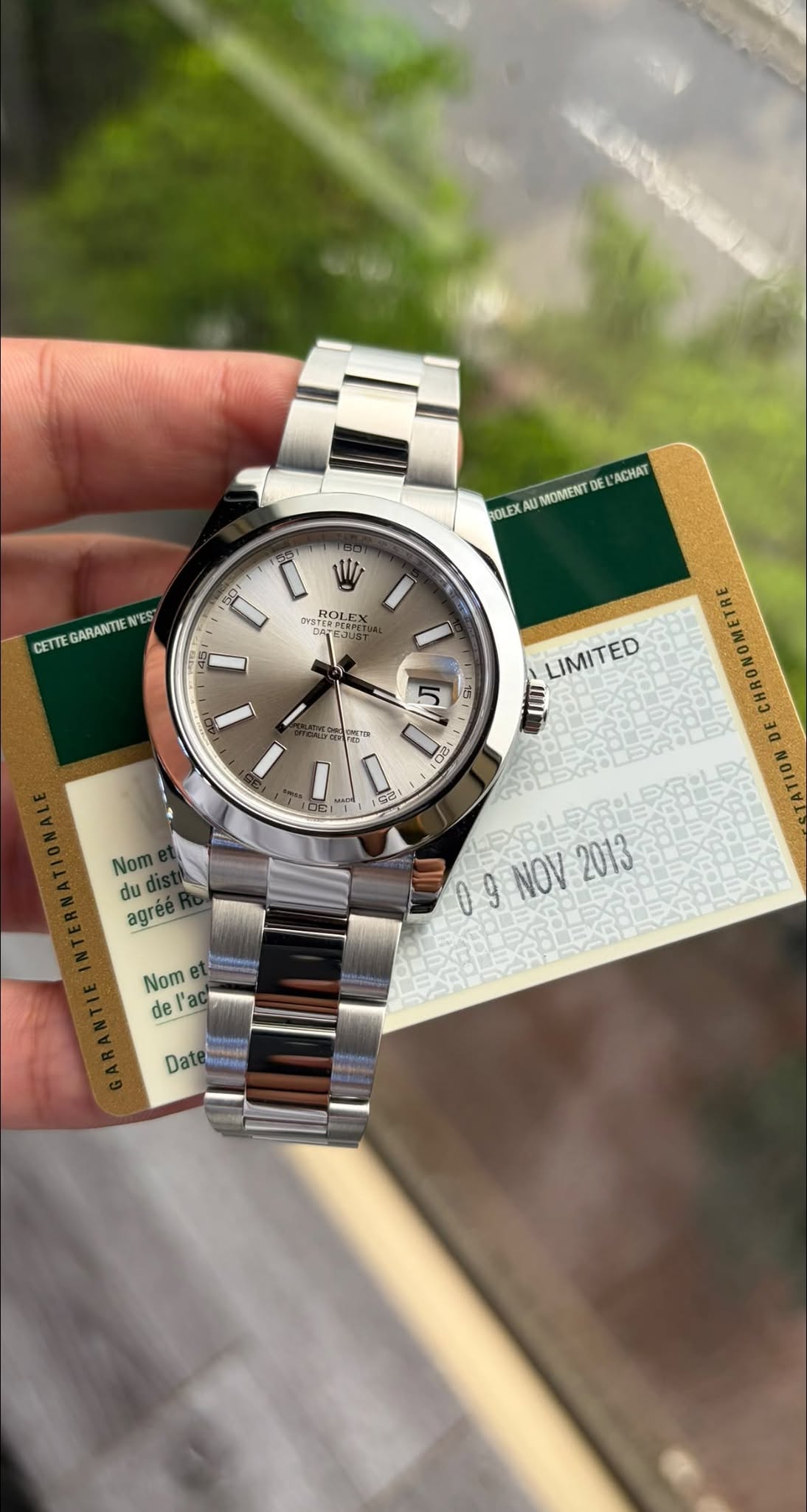 May be an image of wrist watch and text that says 'ROLEX AN3 MOMIENT DEL ACHAT CETTE GARANTIE N'ES فن ROLEX 5 15 咖尚 PMMT LIMITED INI 되고 Nom du agréé agree 사용 00 09 9 NOV 假提.…