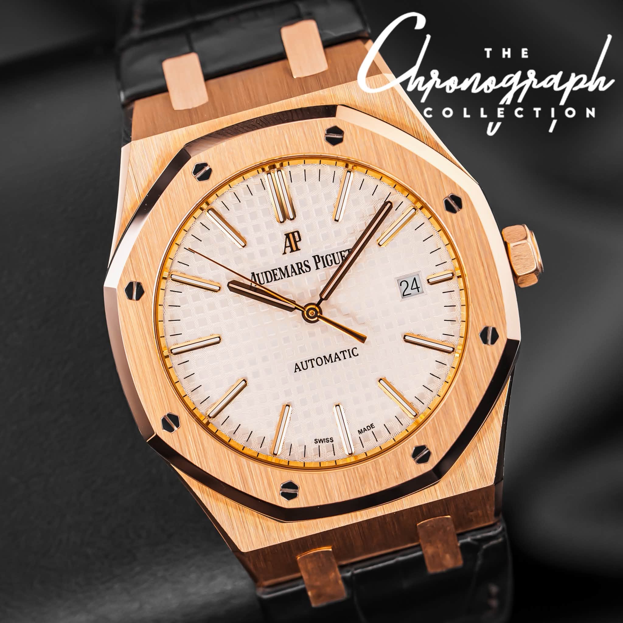 May be an image of wrist watch and text that says 'Clparizjaph nponograph THE COLLECTION AP UDEMARS AUDEMARSPIGUE PIGUE n 24 AUTOMATIC MADE SWISS'