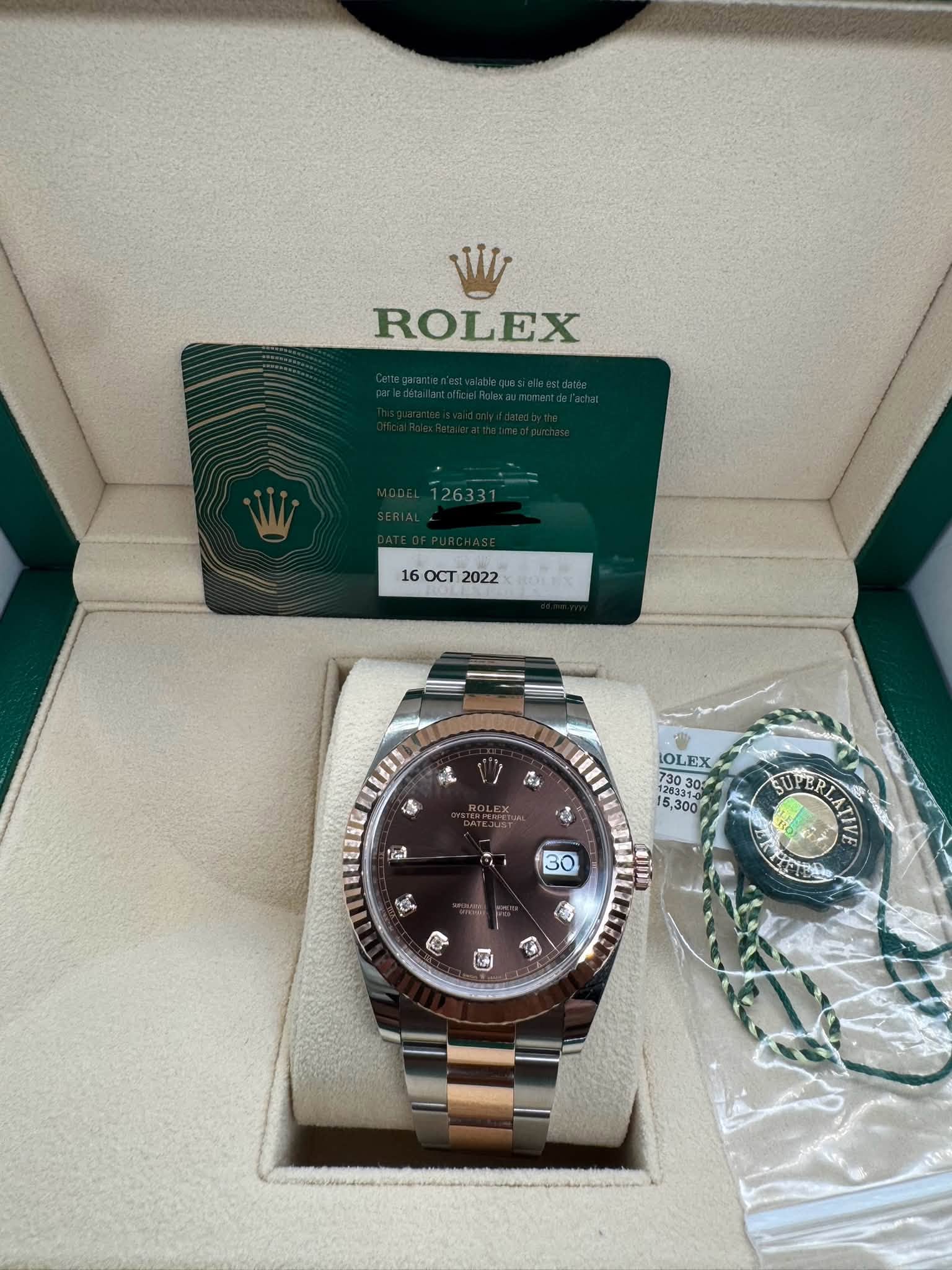 May be an image of wrist watch and text that says 'W ROLEX 160CT2022 16 OCT 2022 L LUEE S " OLEX ,300 taa SUPER EUVEPIAT RL 30 艾か'