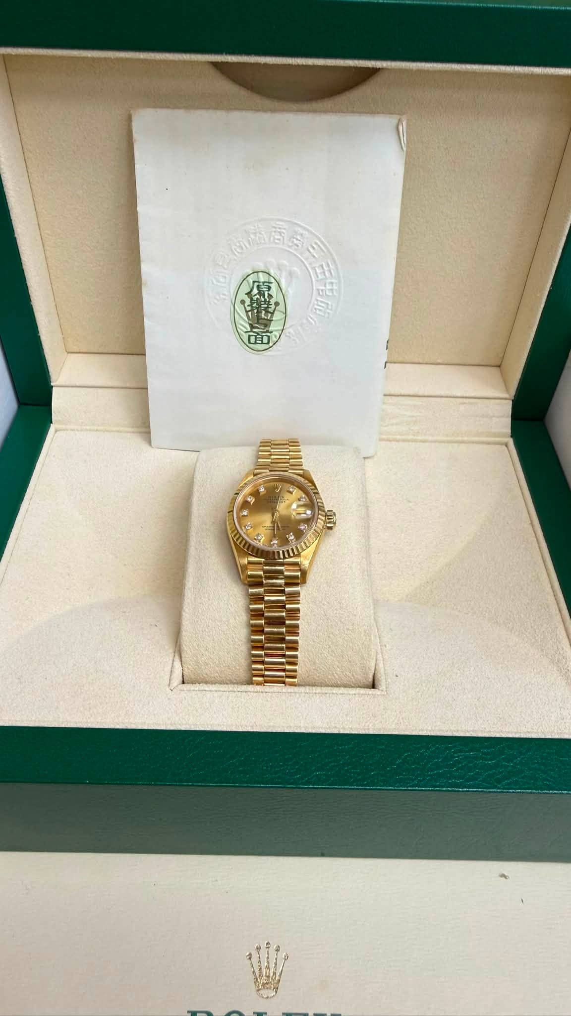 May be an image of wrist watch and text