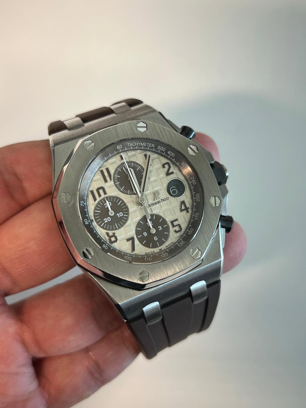 May be an image of wrist watch and text