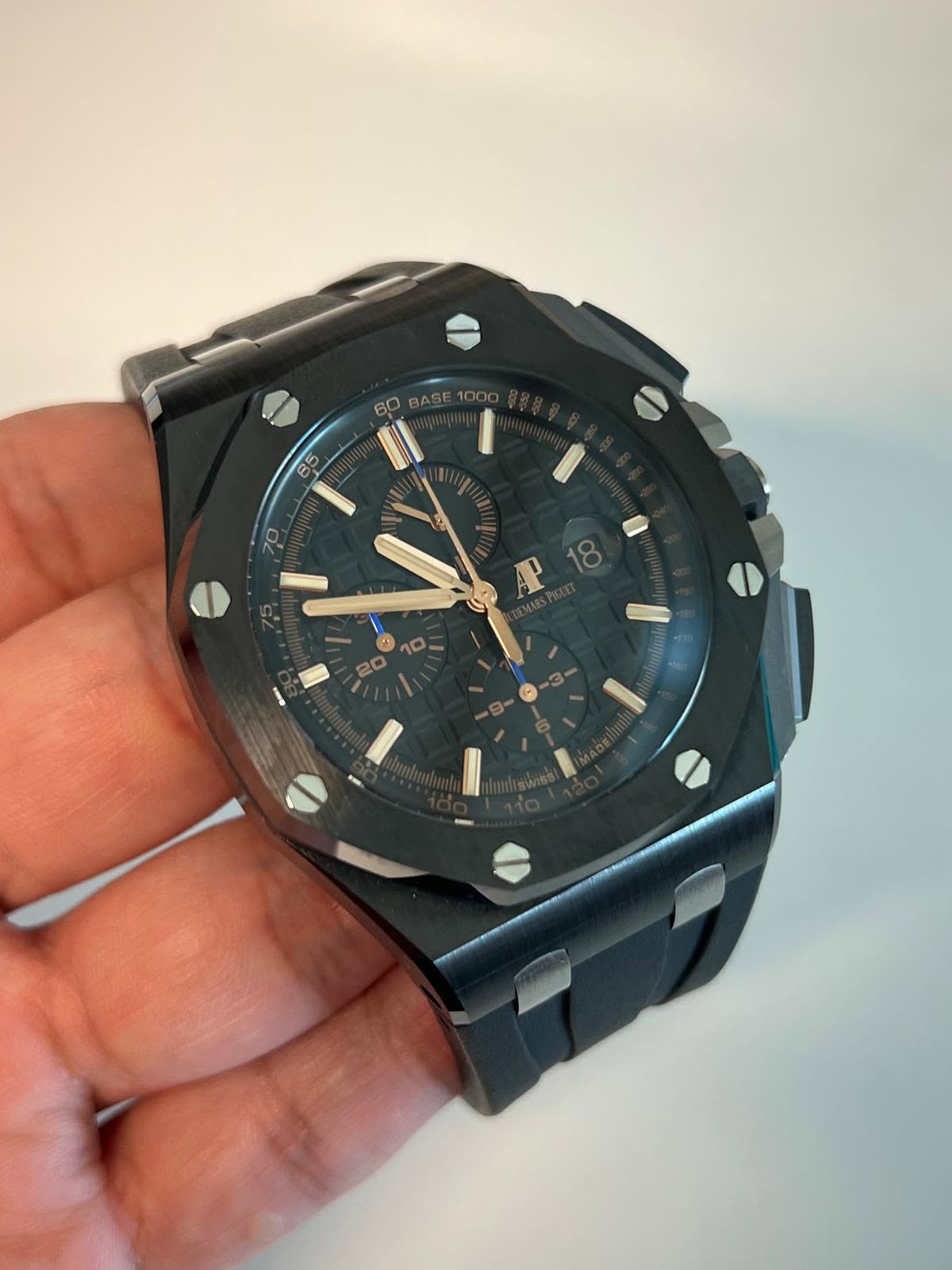May be an image of wrist watch and text