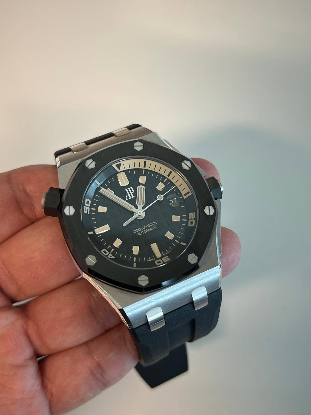 May be an image of wrist watch and text that says 'AP 50 27 /1000rs 300m 200m/1000 UTONA 20 Ο'