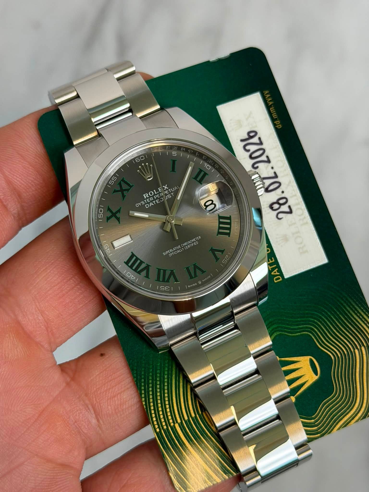 May be an image of wrist watch and text