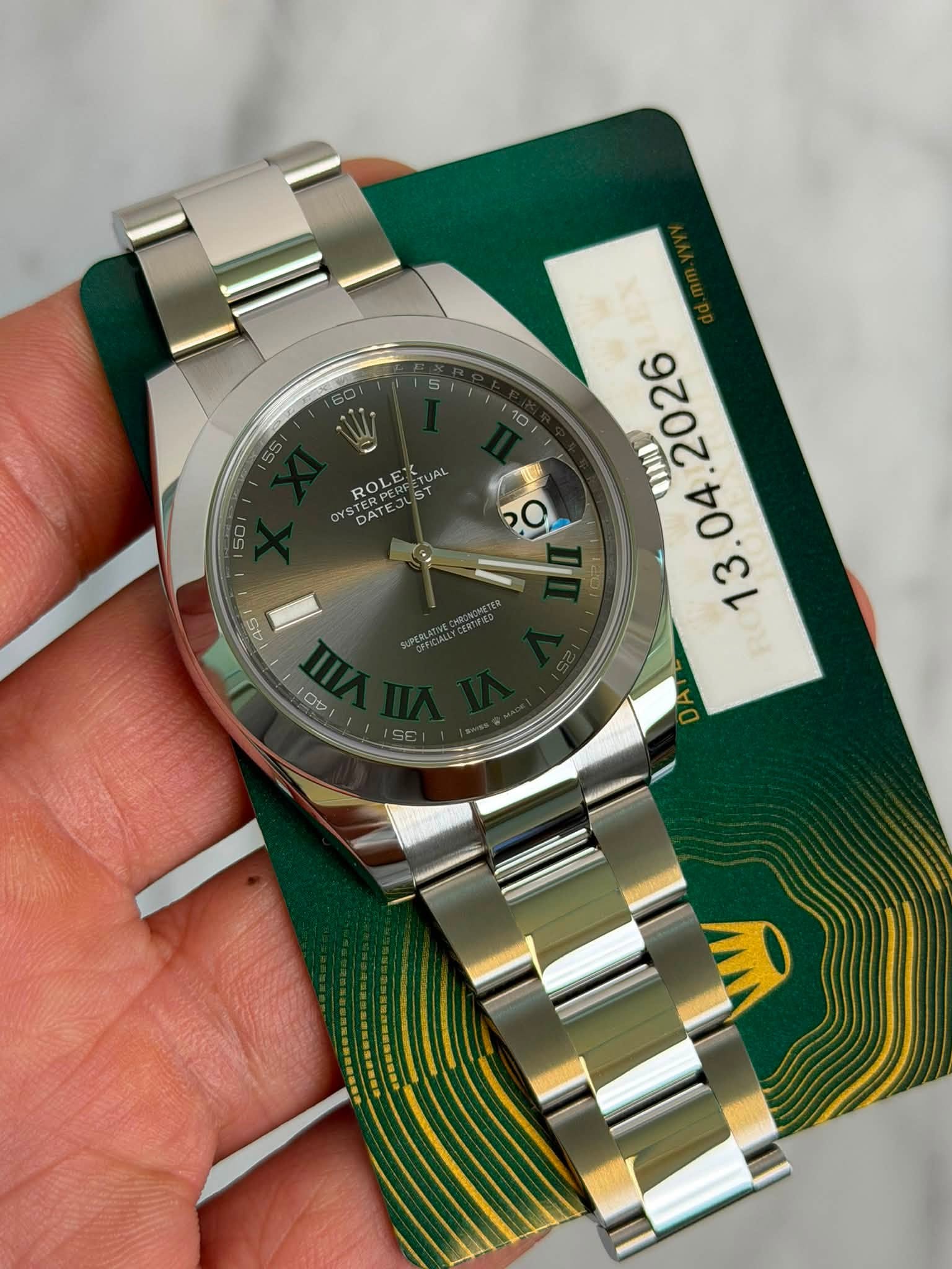 May be an image of wrist watch and text that says '10 ROLETUAL ROLE ST DATE DAT 45 PO '