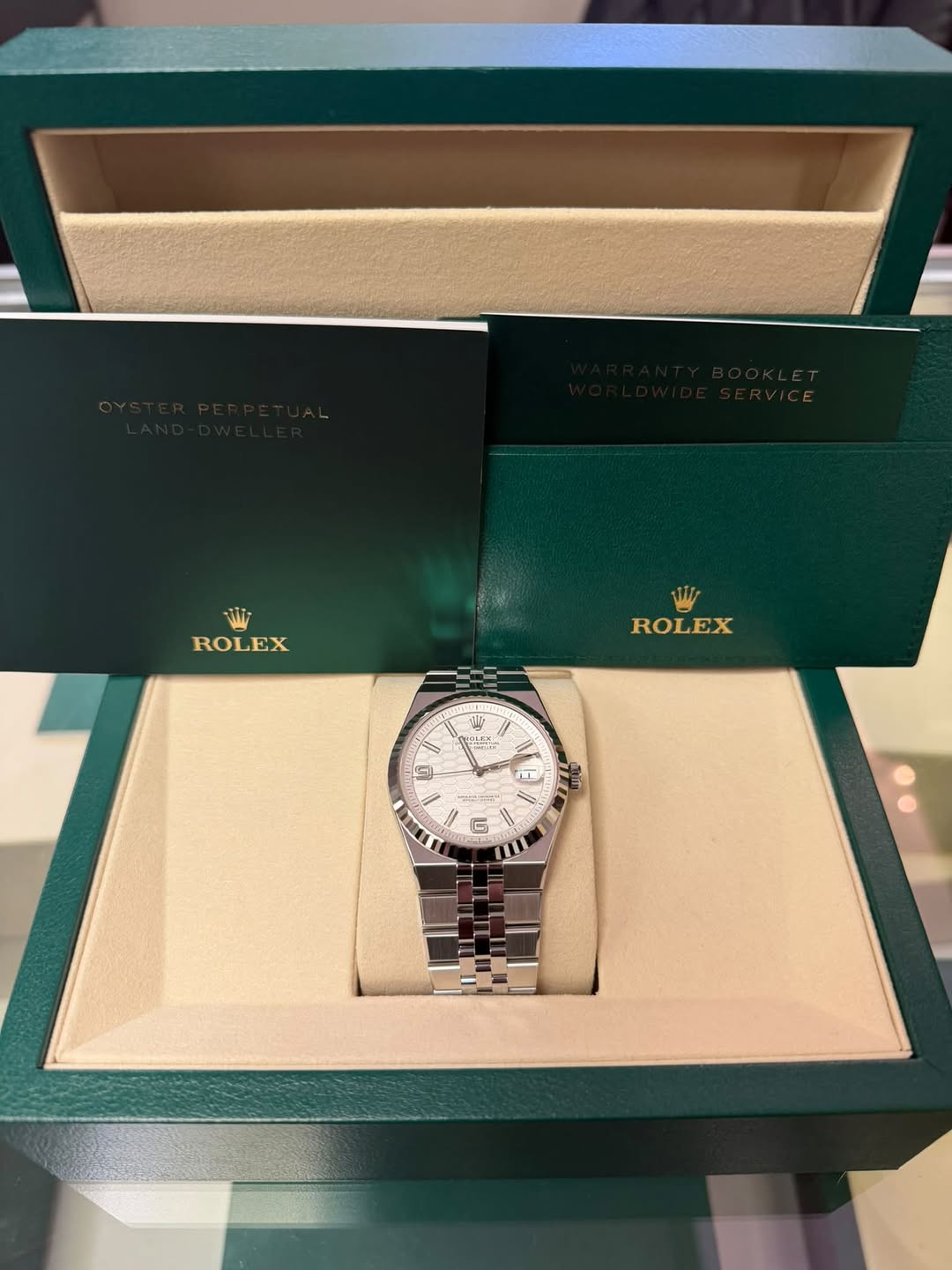 May be an image of wrist watch and text