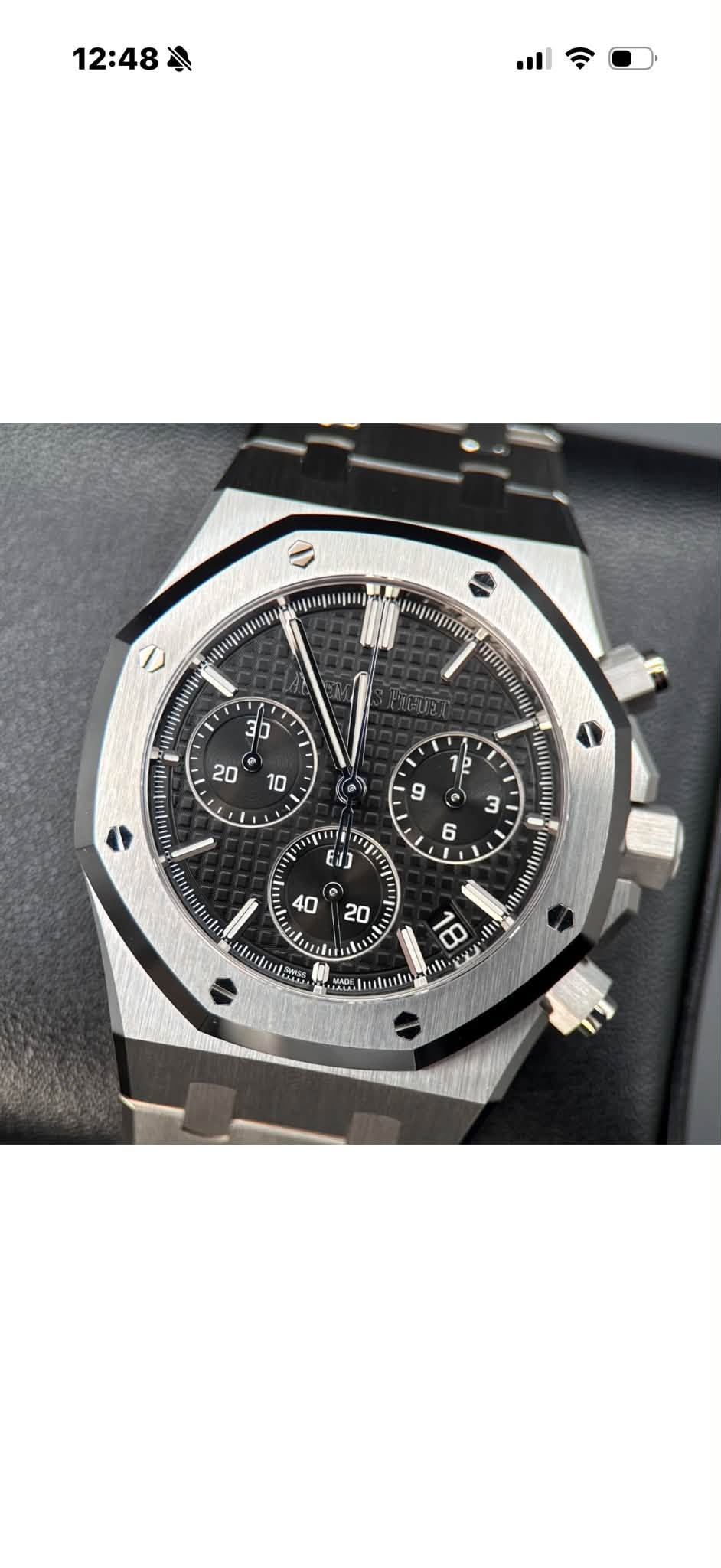 May be an image of wrist watch and text
